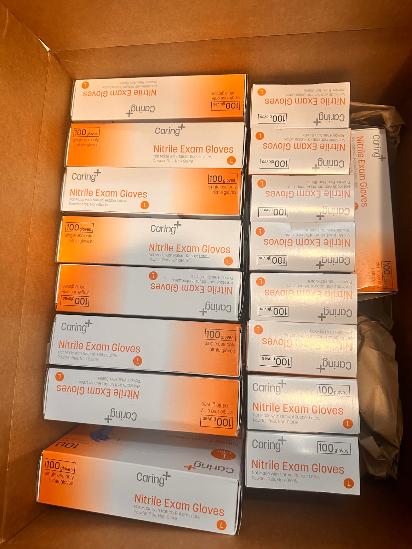 Boxes of nitrile examination gloves packed in a cardboard box