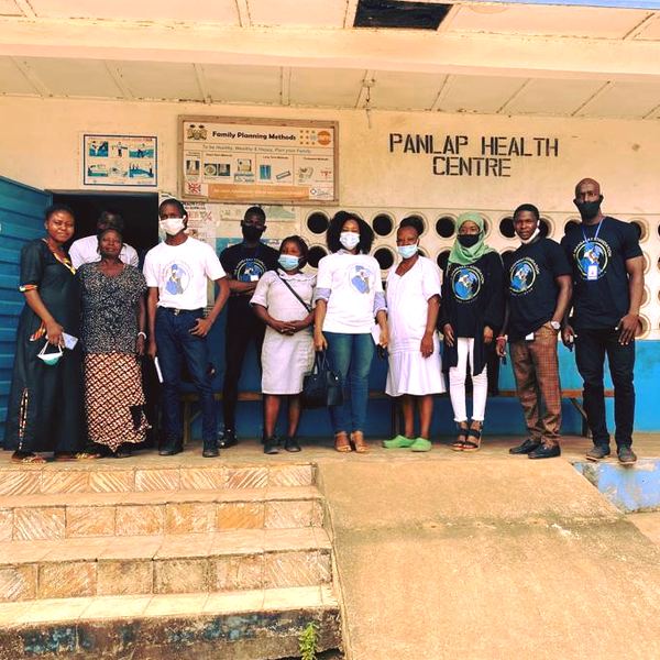 TMF team members and health workers standing outside Panlap Health Centre