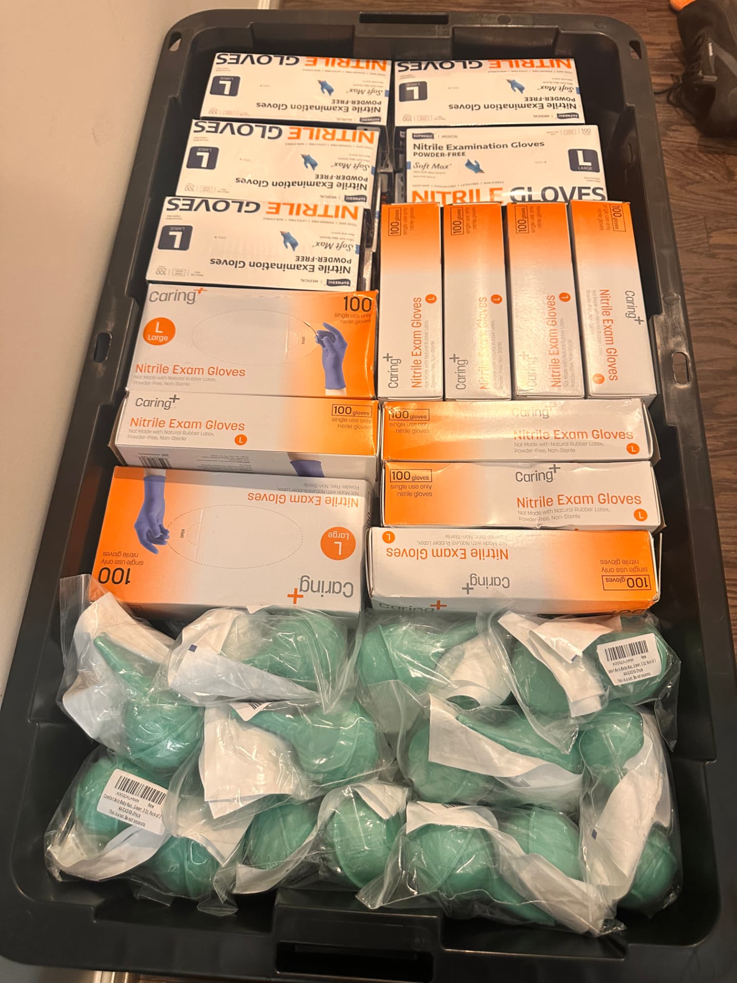 Nitrile gloves and other clinical supplies packed in a bin