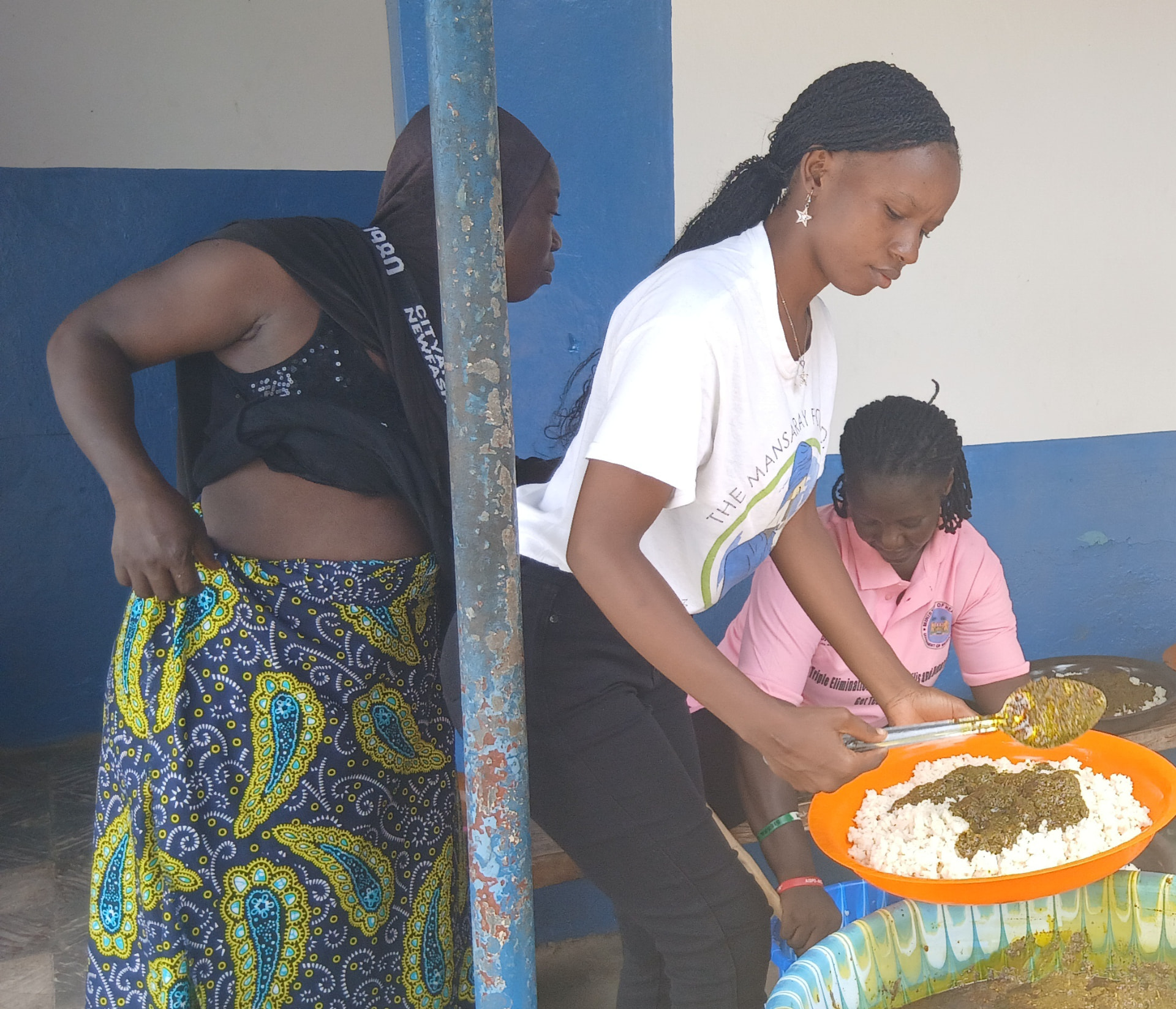 A community meal being served during a maternal wellness gathering